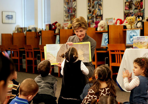 A little reader takes a closer look as Mrs. Laura Bush reads the children's book, "I Love You, Little One," by Nancy Tafuri during a visit to the Jenna Welch and Laura Bush Community Library in El Paso, Texas, Wednesday, Oct. 18, 2006. Since the library opened in 2003, the number of programs and attendance has tripled. Through the past year, the Library hosted 349 programs for more than 10,000 participants. White House photo by Shealah Craighead