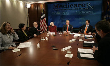 President George W. Bush participates in a roundtable discussion on Medicare Friday, Oct. 20, 2006 at the Department of Health and Human Services in Washington, D.C. Participants included Dr. William Hardison and wife, Lois, seated to the President's left, a retired couple from Springfield, Va., who receive Medicare and estimate they've saved more than $1,000 so far this year with the Part D Plan. White House photo by Kimberlee Hewitt