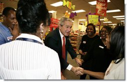 President George W. Bush meets employees at a pharmacy in Washington, D.C. Friday, Oct. 20, 2006, during a visit to the store where he talked about the Medicare Part D Plan. "Our seniors are saving money, they're getting better coverage," said the President. "It's a plan that I'm real proud of."  White House photo by Kimberlee Hewitt