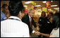 President George W. Bush meets employees at a pharmacy in Washington, D.C. Friday, Oct. 20, 2006, during a visit to the store where he talked about the Medicare Part D Plan. "Our seniors are saving money, they're getting better coverage," said the President. "It's a plan that I'm real proud of." White House photo by Kimberlee Hewitt