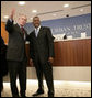 President George W. Bush is welcomed by Bob Johnson, founder and chairman of the RLJ Companies, to the Urban Trust Bank for a discussion on the economy with small business owners and community bankers, Monday, Oct. 23, 2006 in Washington, D.C. White House photo by Eric Draper