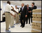 President George W. Bush shakes hands with employees at Gyrocam Systems in Sarasota, Fla., Tuesday, Oct. 24, 2006, during a visit that highlighted technology to help soldiers fight the war on terrorism. White House photo by Eric Draper