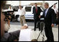 President George W. Bush speaks to the media after an unannounced visit Tuesday, Oct. 24, 2006, to Gyrocam Systems in Sarasota, Fla. Speaking to the business's entrepreneurial spirit, the President said, "It is strong inside this company, and we intend to keep it strong by keeping taxes low, less regulation, hopefully less lawsuits, and our economy will remain strong." White House photo by Eric Draper