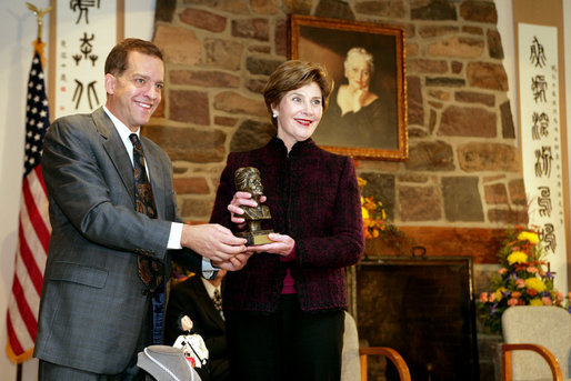 John Long, Chairman of the Board of Directors, Pearl S. Buck International, presents Mrs. Laura Bush with the 2006 Pearl S. Buck Woman of the Year award Tuesday, October 24, 2006, at the Pearl S. Buck House in Perkasie, Pennsylvania. The Pearl S. Buck award is given to honor women who make outstanding contributions in the areas of cross-cultural understanding, humanitarian outreach, and improving the life and expanding opportunities for children around the world. White House photo by Shealah Craighead