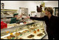 Mrs. Laura Bush purchases a box of homemade chocolates Tuesday, October 24, 2006, at Seroogy’s, a family owned business that has been making chocolates for more than a hundred years in De Pere, Wisconsin. White House photo by Shealah Craighead