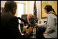Vice President Dick Cheney talks with Juan Williams, left, of National Public Radio during a taped radio interview in the Vice President's office during the White House Radio Day, Tuesday, October 24, 2006. White House photo by David Bohrer