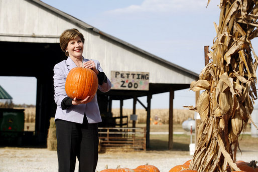 Mrs. Laura Bush picks out a pumpkin at Hackman’s Farm Market and Green House Wednesday, October 25, 2006, in Columbus, Indiana. White House photo by Shealah Craighead