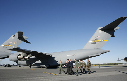 President George W. Bush walks past C-17 aircraft before addressing military personnel and their families at Charleston Air Force Base in Charleston, South Carolina on Saturday, October 28, 2006. White House photo by Paul Morse
