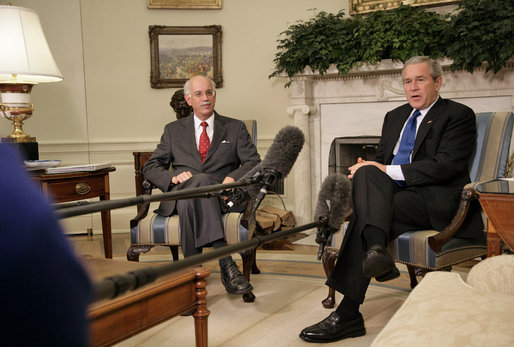 President George W. Bush and Andrew Natsios, Presidential Special Envoy for Sudan, meet with the press in the Oval Office Tuesday, Oct. 31, 2006. "The situation in Darfur is on our minds," said the President. "The people who have suffered there need to know that the United States will work with others to help solve the problem." White House photo by Kimberlee Hewitt