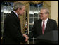 President George W. Bush shakes the hand of outgoing Secretary of Defense Donald Rumsfeld Wednesday, Nov. 8, 2006, in the Oval Office where the President announced the Secretary's resignation and his intention to nominate Dr. Robert Gates as successor. White House photo by Paul Morse