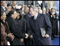 President George W. Bush greets former United Nations Ambassador Andrew Young Monday, Nov. 13, 2006, following President Bush’s speech at the groundbreaking ceremony for the Martin Luther King Jr. National Memorial on the National Mall in Washington, D.C. White House photo by Eric Draper