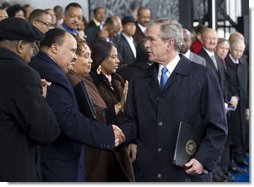 President George W. Bush greets Martin Luther King III and his sisters, Yolanda Denise King and Bernice Albertine King, Monday, Nov. 13, 2006, following President Bush’s speech at the groundbreaking ceremony for the Martin Luther King Jr. National Memorial on the National Mall in Washington, D.C. White House photo by Eric Draper