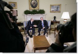 President George W. Bush and Israeli Prime Minister Ehud Olmert shake hands during a brief question and answer opportunity with members of the media Monday, Nov. 13, 2006, in the Oval Office at the White House.  White House photo by Eric Draper