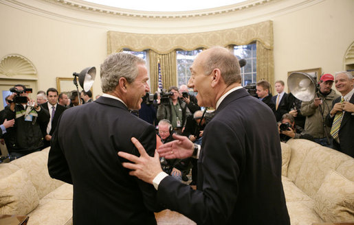 President George W. Bush and Israeli Prime Minister Ehud Olmert stand together talking following their meeting with members of the media Monday, Nov. 13, 2006, in the Oval Office at the White House. White House photo by Eric Draper