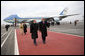 President George W. Bush and Laura Bush walk the red carpet with Russia's President Vladimir Putin and Lyudmila Putina after their arrival Wednesday, Nov. 15, 2006, at Vnukovo Airport in Moscow. White House photo by Eric Draper