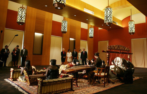 President George W. Bush and Mrs. Laura Bush enjoy a traditional gamelan musical performance during their tour Thursday, Nov. 16, 2006, of the Asian Civilisations Museum in Singapore. White House photo by Paul Morse