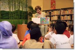 Mrs. Laura Bush reads Miss Spider's Tea Party during her visit Thursday, Nov. 16, 2006, to the National Library Building's Children's Reading Room in Singapore. Afterward, Mrs. Bush participated in a brief question-and-answer session with the kids.  White House photo by Shealah Craighead