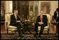 President George W. Bush and Prime Minister Lee Hsien Loong of Singapore, smile for the cameras Thursday, Nov. 16, 2006, during a visit by President Bush to Istana, the presidential palace, in Singapore. The two had "a wide-ranging discussion," according to the President, during which they discussed economics and terrorism. White House photo by Eric Draper