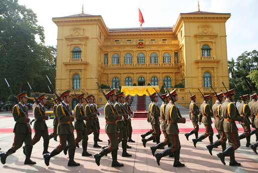 An honor guard passes by the Presidential Palace in Hanoi Friday, Nov. 17, 2006, during the arrival ceremony for President George W. Bush and Mrs. Laura Bush. White House photo by Paul Morse