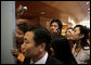 Onlookers strain for a glimpse of the leaders Saturday, Nov. 18, 2006, as the 2006 APEC Summit got under way at the National Conference Center in Hanoi. White House photo by Eric Draper