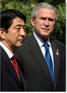 President George W. Bush and Prime Minister Shinzo Abe of Japan talk with the media during a photo opportunity Saturday, Nov. 18, 2006, following their lunch at the Sheraton Hanoi hotel. White House photo by Eric Draper