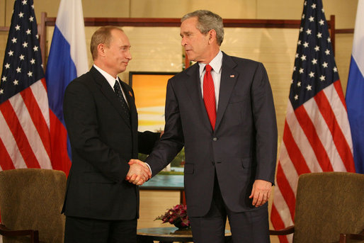 President George W. Bush and President Vladimir Putin of Russia exchange handshakes Sunday, Nov. 19, 2006, at the Sheraton Hanoi after their two countries signed agreements supporting Russia's accession into the World Trade Organization. Said President Bush afterward, "This is a good agreement for the United States. And it's an equally important agreement for Russia. And it's a good agreement for the international trading community." White House photo by Eric Draper