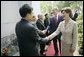 Mrs. Laura Bush is greeted as she and President George W. Bush arrive for church services Sunday, Nov. 19, 2006, at Cua Bac Church in Hanoi. White House photo by Eric Draper