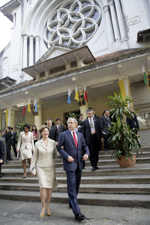 President George W. Bush and Mrs. Laura Bush leave the Cua Bac Church in Hanoi Sunday, Nov. 19, 2006, following morning services. The President stopped for a brief statement afterward during which he said, "A whole society is a society which welcomes basic freedom, and there's no more basic freedom than the freedom to worship." White House photo by Eric Draper
