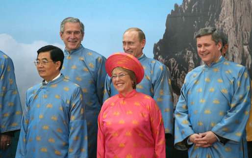 President George W. Bush joins Russian President Vladimir Putin, Canada's Prime Minister Stephen Harper, President Michelle Bachalet of Chile, and President Hu Jintao of China as they await the official 2006 APEC portrait Sunday, Nov. 19, 2006, in Hanoi. White House photo by Eric Draper