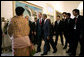 President George W. Bush greets participants as he heads to a roundtable discussion Monday, Nov. 20, 2006, at the Bogor Palace in Bogor, Indonesia. White House photo by Eric Draper