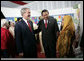 President George W. Bush and Indonesian President Susilo Bambang Yudhoyono talk with an educator Monday, Nov. 20, 2006, during a drop-by educational event at the Bogor Palace in Bogor, Indonesia. White House photo by Eric Draper