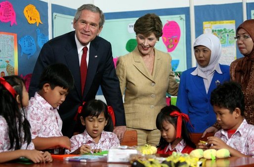 President George W. Bush and Mrs. Laura Bush pose with 6th graders during a drop-by education event Monday, Nov. 20, 2006, at the Bogor Palace in Bogor, Indonesia. White House photo by Eric Draper