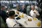 President George W. Bush joins Admiral William J. Fallon, right, Commander of the U.S. Pacific Command, and other military personnel during a breakfast Tuesday, Nov. 21, 2006, at the Officers Club at Hickam Air Force Base in Honolulu, Hawaii. White House photo by Eric Draper