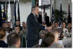 President George W. Bush delivers his remarks following his breakfast meeting with U.S. military troops at Hickam Air Force Base, Tuesday, Nov. 21, 2006 in Honolulu, Hawaii. President Bush thanked the group for their warm reception and for their service and sacrifice to the nation.  White House photo by Paul Morse