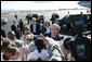 President George W. Bush and Laura Bush shake hands with military personnel as they prepare to depart Honolulu, Hawaii, Tuesday, Nov. 21, 2006, for their flight home to Washington, D.C., following their eight-day trip to Asia. White House photo by Paul Morse