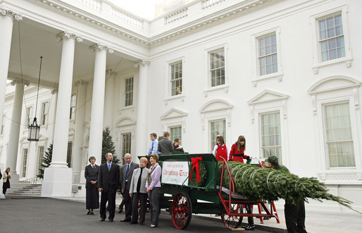 Mrs. Laura Bush stands with the Botek family of Lehighton, Pa., as she receives the official White House Christmas tree on the North Portico Monday, Nov. 27, 2006. The Botek family owns Crystal Springs Tree Farm and donated the 18-foot Douglas fir tree. White House photo by Shealah Craighead