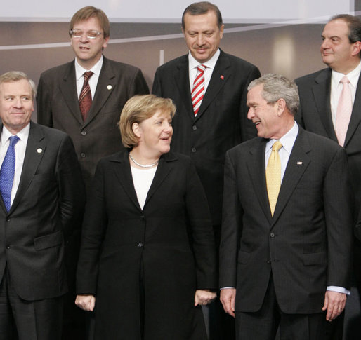 President George W. Bush and Chancellor Angela Merkel of Germany join other NATO heads of state and government for the official portrait Wednesday, Nov. 29, 2006, at the 2006 NATO Summit in Riga, Latvia. White House photo by Paul Morse
