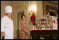 Mrs. Laura Bush and former chef Roland Mesnier discuss the gingerbread White House with the press in the State Dining Room Thursday, Nov. 30, 2006. The house consists of more than 300 pounds of dark chocolate and gingerbread. White House photo by Shealah Craighead