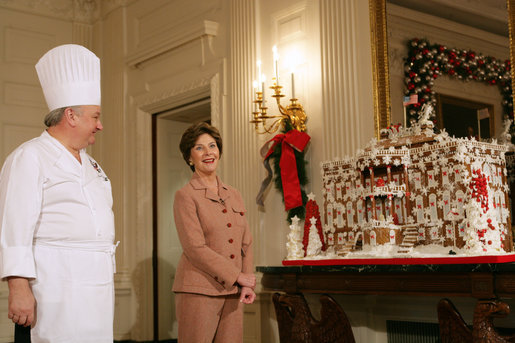 Mrs. Laura Bush and former chef Roland Mesnier discusses the gingerbread White House with the press in the State Dining Room Thursday, Nov. 30, 2006. The house consists of more than 300 pounds of dark chocolate and gingerbread. White House photo by Shealah Craighead