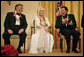 Conductor Zubin Mehta laughs with singers Dolly Parton and William "Smokey" Robinson during a reception for the Kennedy Center honorees in the East Room Sunday, Dec. 3, 2006. White House photo by Eric Draper