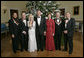 President George W. Bush and Mrs. Laura Bush stand with the Kennedy Center honorees in the Blue Room of the White House during a reception Sunday, Dec. 3, 2006. From left, they are: singer and songwriter William "Smokey" Robinson; musical theater composer Andrew Lloyd Webber; country singer Dolly Parton; film director Steven Spielberg; and conductor Zubin Mehta. White House photo by Eric Draper