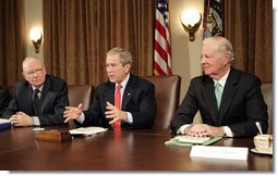 President George W. Bush addresses the press during a meeting with the Iraq Study Group in the Cabinet Room Wednesday, Dec. 6. 2006. Pictured with the President are the group's co-chairmen former Representative Lee Hamilton, left, and former Secretary of State James Baker. The group presented a report assessing the situation in Iraq. In his comments to the press, the President said, ". this report will give us all an opportunity to find common ground, for the good of the country -- not for the good of the Republican Party or the Democratic Party, but for the good of the country."  White House photo by Eric Draper