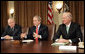 President George W. Bush addresses the press during a meeting with the Iraq Study Group in the Cabinet Room Wednesday, Dec. 6. 2006. Pictured with the President are the group's co-chairmen former Representative Lee Hamilton, left, and former Secretary of State James Baker. The group presented a report assessing the situation in Iraq. In his comments to the press, the President said, ". this report will give us all an opportunity to find common ground, for the good of the country -- not for the good of the Republican Party or the Democratic Party, but for the good of the country."  White House photo by Eric Draper
