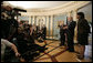 President George W. Bush stands with Secretary of State Condoleezza Rice and Vice President Dick Cheney as he speaks to the media following a meeting Monday, Dec. 11, 2006, with senior U.S. Department of State officials on Iraq at the State Department in Washington, D.C.  White House photo by Eric Draper