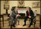 President George W. Bush meets with Vice President Tariq al-Hashemi of Iraq in the Oval Office Tuesday, Dec. 12, 2006. The two men spent their time together talking about the conditions in Iraq and what the United States can do to help the country's government succeed.  White House photo by Eric Draper