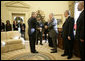 President George W. Bush shakes the hand of Vice President Tariq al-Hashemi of Iraq as they near the end of their Oval Office visit Tuesday, Dec. 12, 2006. The President told Vice President Hashemi, "Our objective is to help the Iraqi government deal with the extremists and killers, and support the vast majority of Iraqis who are reasonable people who want peace." White House photo by Eric Draper