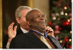 B.B. King breaks out in laughter as he's presented with the Presidential Medal of Freedom Friday, Dec. 15, 2006, by President George W. Bush in the East Room of the White House. Introducing the musician, President Bush told the audience, when speaking of the blues, "two names are paramount. B.B. King, and his guitar, Lucille. America loves the music of B.B. King, and America loves the man, himself."  White House photo by Shealah Craighead