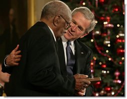 President George W. Bush presents the 2006 Presidential Medal of Freedom to Warren O'Neil on behalf of his brother, baseball great Buck O'Neil, who passed away at the age of 94 in October. Said the President upon presentation of the honor, "Buck O'Neil lived long enough to see the game of baseball, and America, change for the better. He's one of the people we can thank for that. Buck O'Neil was a legend, and he was a beautiful human being. And we honor the memory of Buck O'Neil."  White House photo by Shealah Craighead