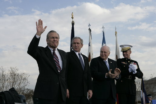 Secretary of Defense Donald Rumsfeld acknowledges a standing ovation in his honor joined by President George W. Bush, Vice President Dick Cheney and General Peter Pace, Chairman of the Joint Chiefs of Statf, following Rumsfeld's farewell address Friday, Dec. 15, 2006, at the Armed Forces Full Honor Review at the Pentagon. The Secretary, who has served since 2001, told the audience that he will remember "all those couragous folks that I have met deployed in the field; those in the military hospitals that we visited; and I will remember the fallen, and I will particularly remember their families from whom I have drawn inspiration." White House photo by Eric Draper