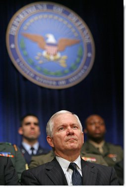 Robert Gates listens to President George W. Bush speak during his swearing-in ceremony as Secretary of Defense at the Pentagon Monday, Dec. 18, 2006.  White House photo by Eric Draper